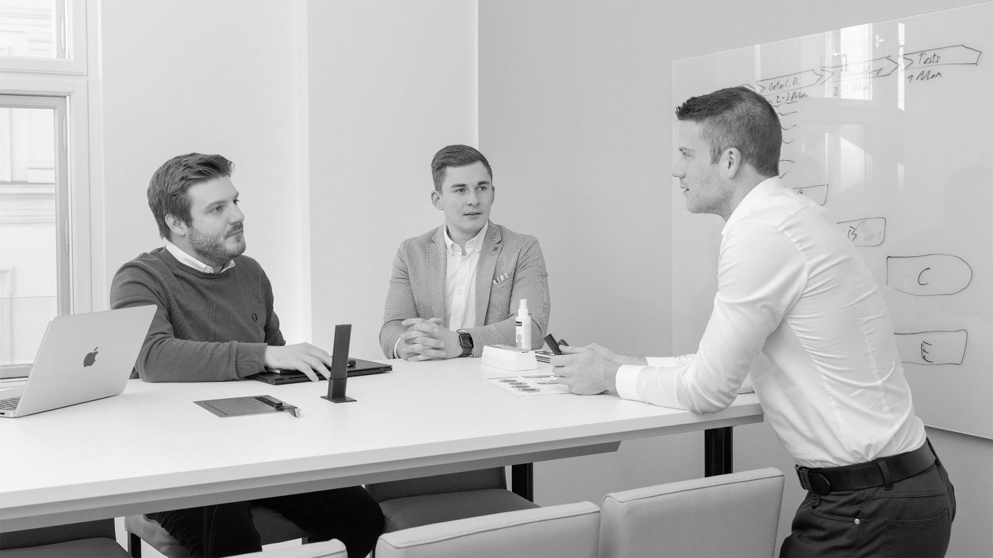 A group of young professionals collaborating in a modern office
