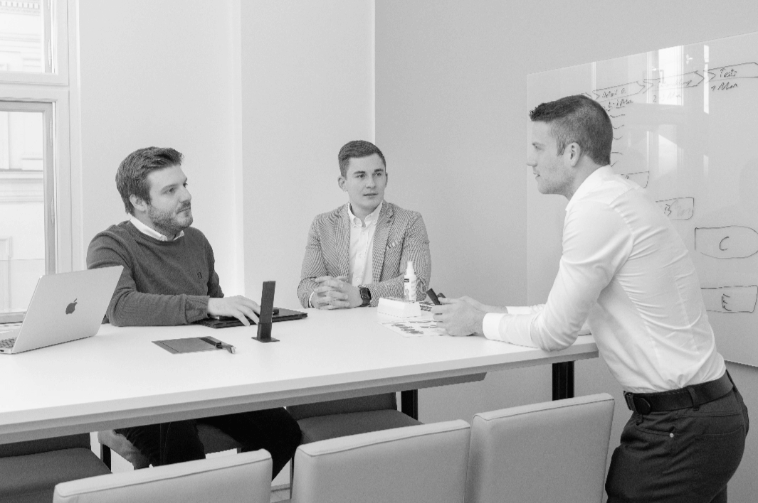 A group of young professionals collaborating in a modern office